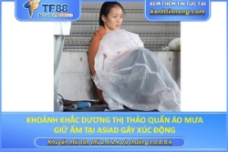 Khoảnh khắc dương thị thảo quấn áo mưa giữ ấm tại asiad gây xúc động